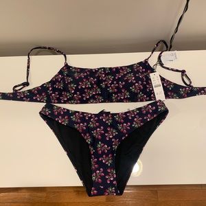 J.Crew bikini.Size small. Navy blue with purple flowers.Tags on and never worn.